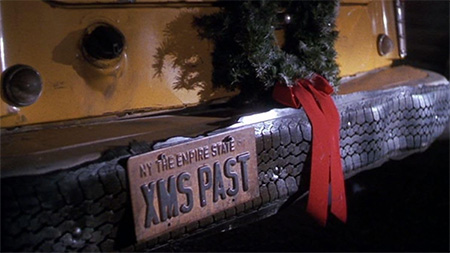 Bumper of a car with the license plate "XMAS PAST"