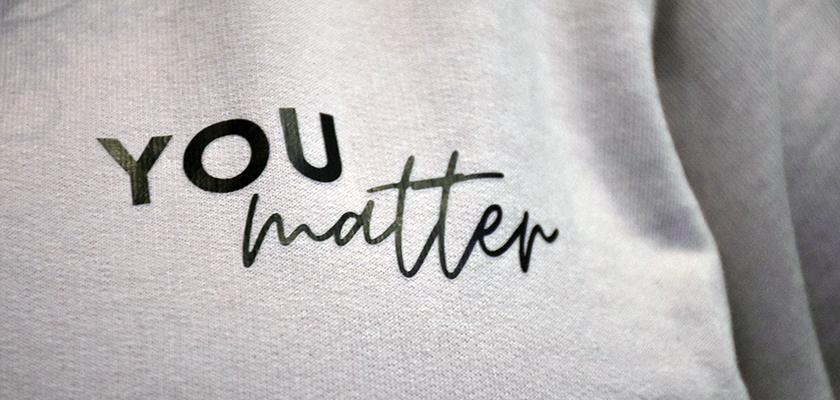 A close up of a shirt that reads, "You matter"