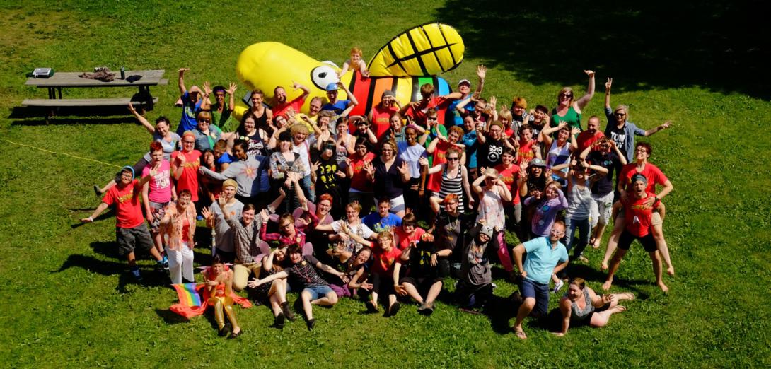 Aerial photo of campers in front of a giant inflated firefly