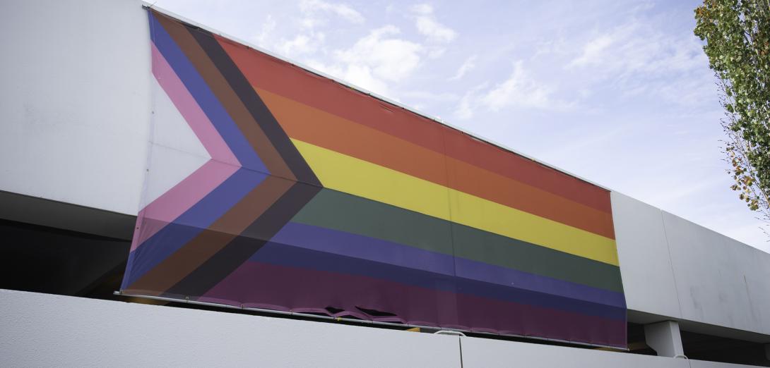 Pride flag affixed to the ATA parkade